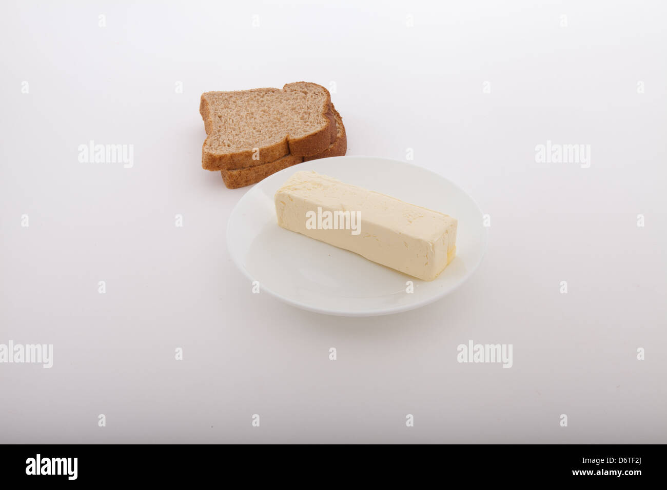 butter and two slices of wheat toast Stock Photo Alamy