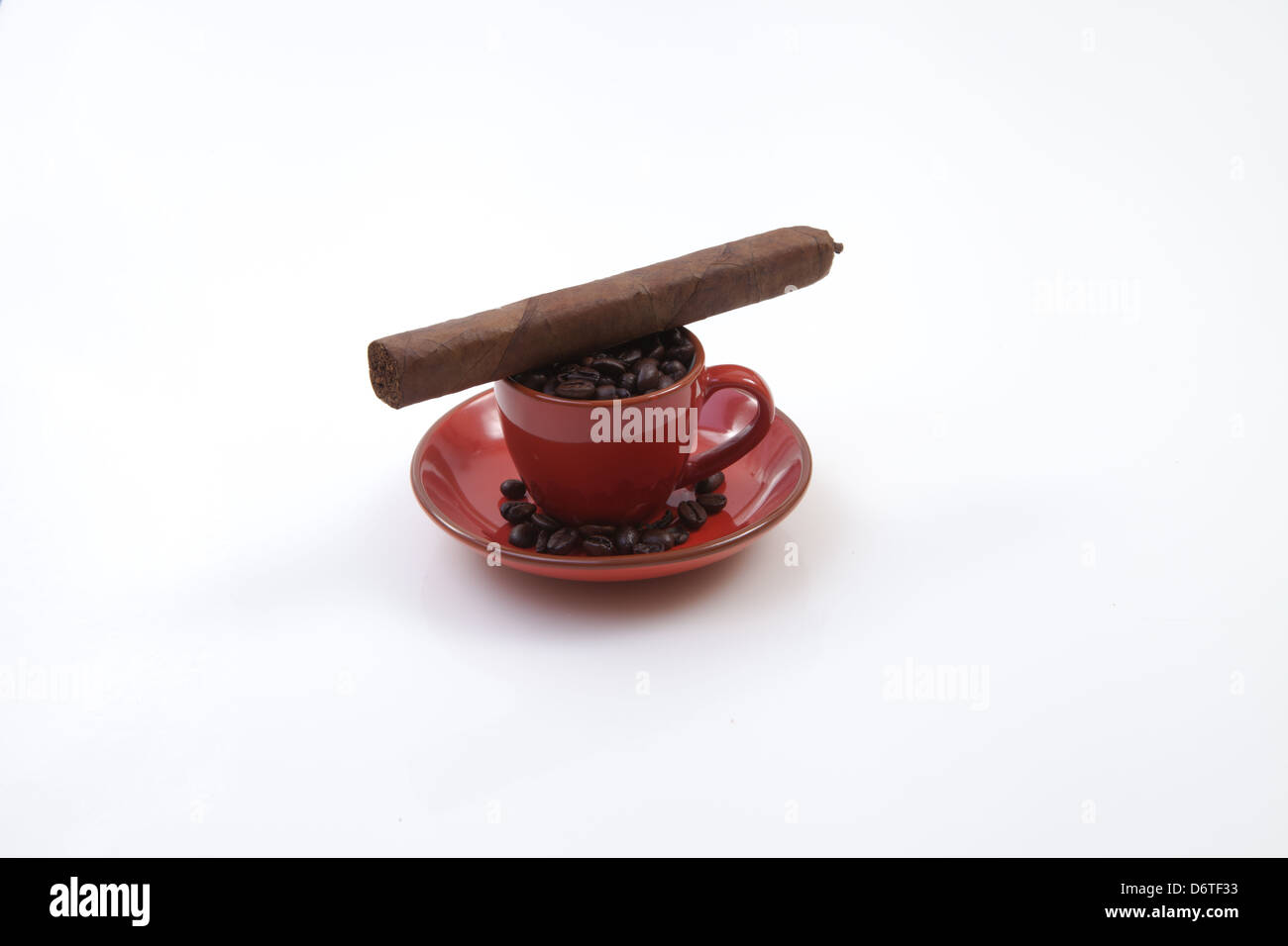https://c8.alamy.com/comp/D6TF33/cigar-and-red-cuban-coffee-cup-filled-with-coffee-beans-D6TF33.jpg