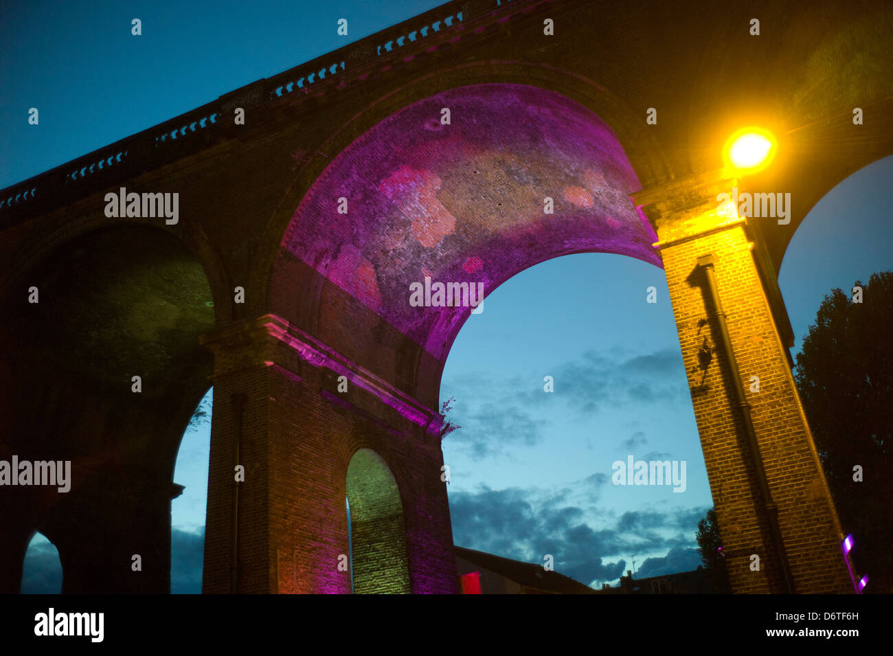 Railway viaduct, coloured lighting, Brighton, UK, evening Stock Photo