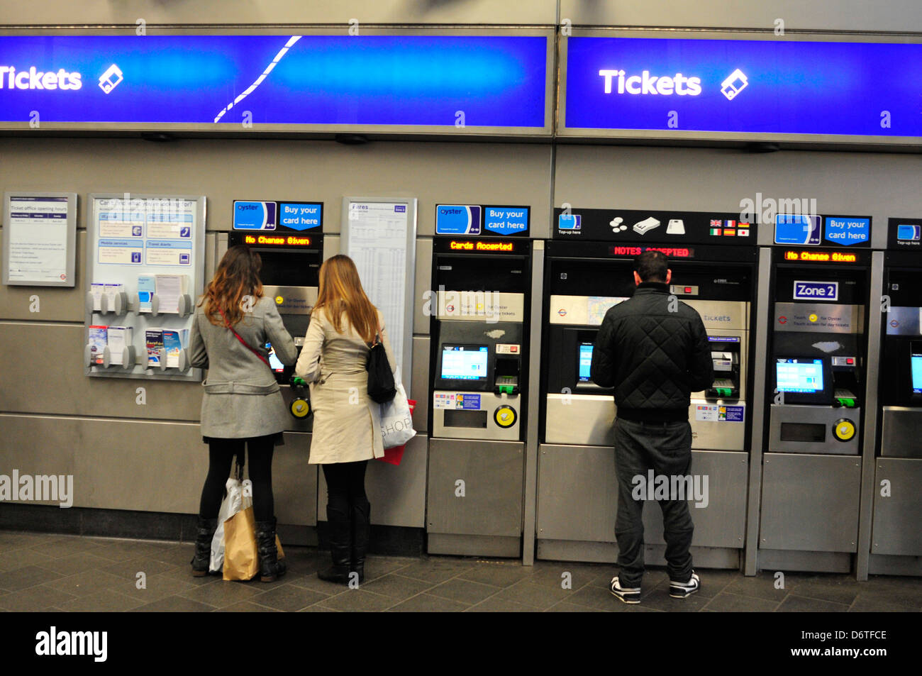 Commuters buy ticket at an Underground station in London, UK. Stock Photo