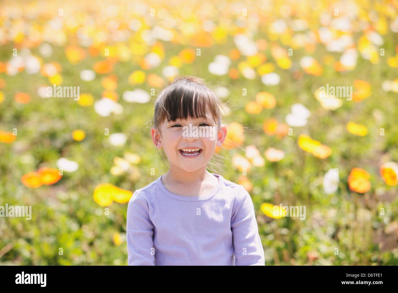 Young girl smiling at camera Stock Photo - Alamy