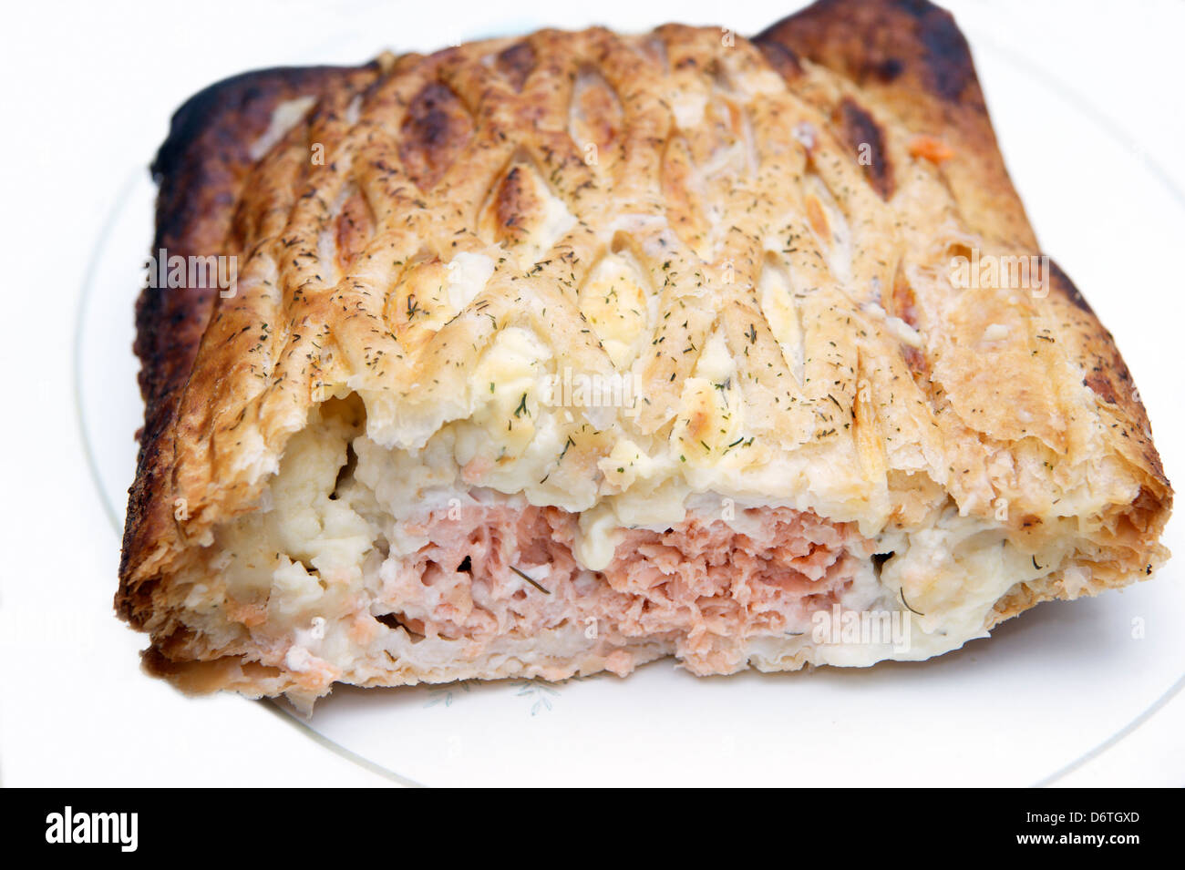 Salmon en croute pastry pie showing the filling Stock Photo Alamy