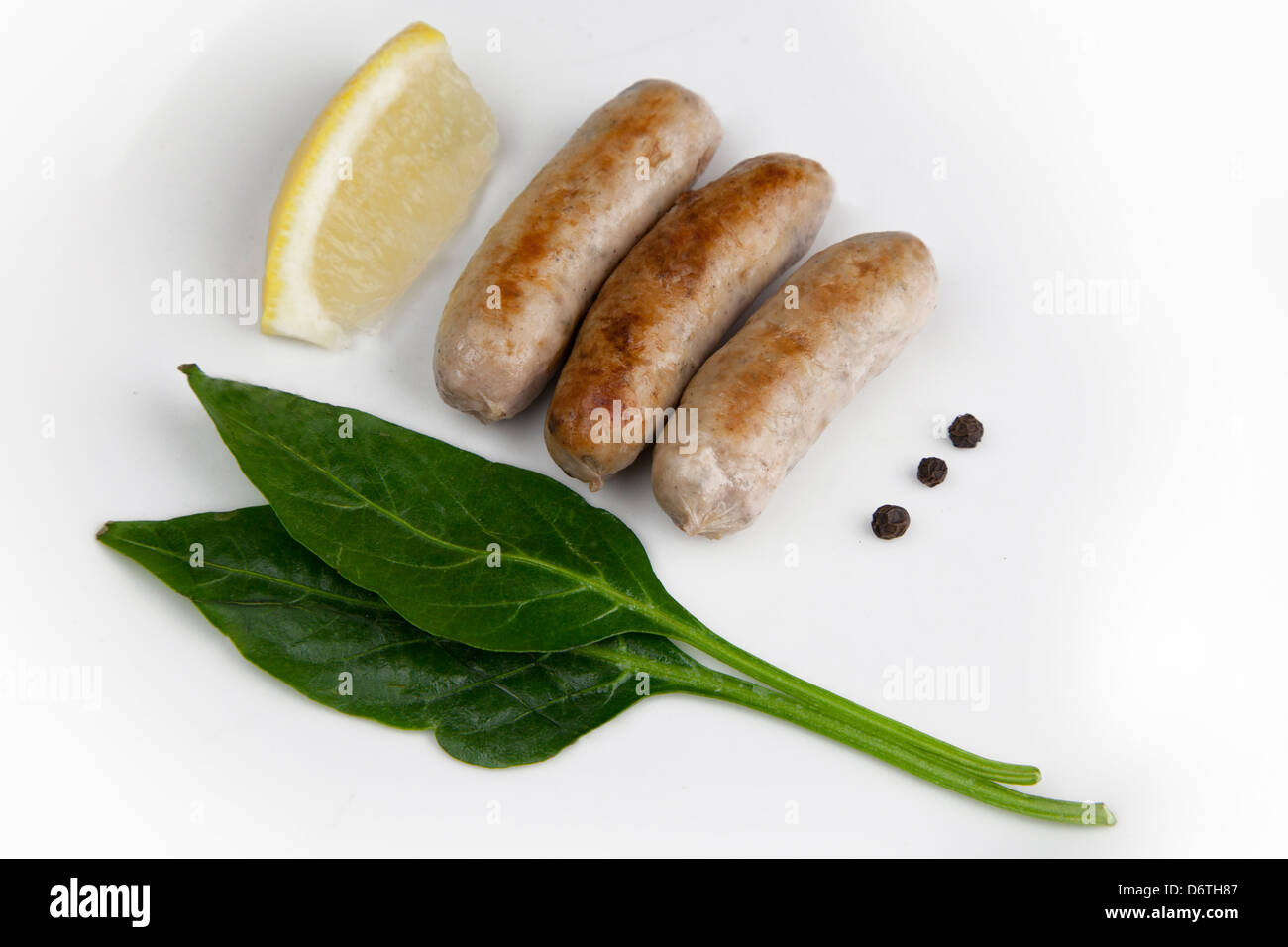 Traditional English sausages cooked with basil, lemon, black pepper