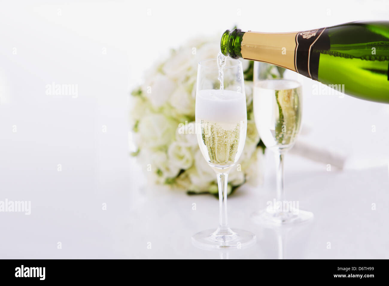 Wedding bouquet and sparkling wine Stock Photo