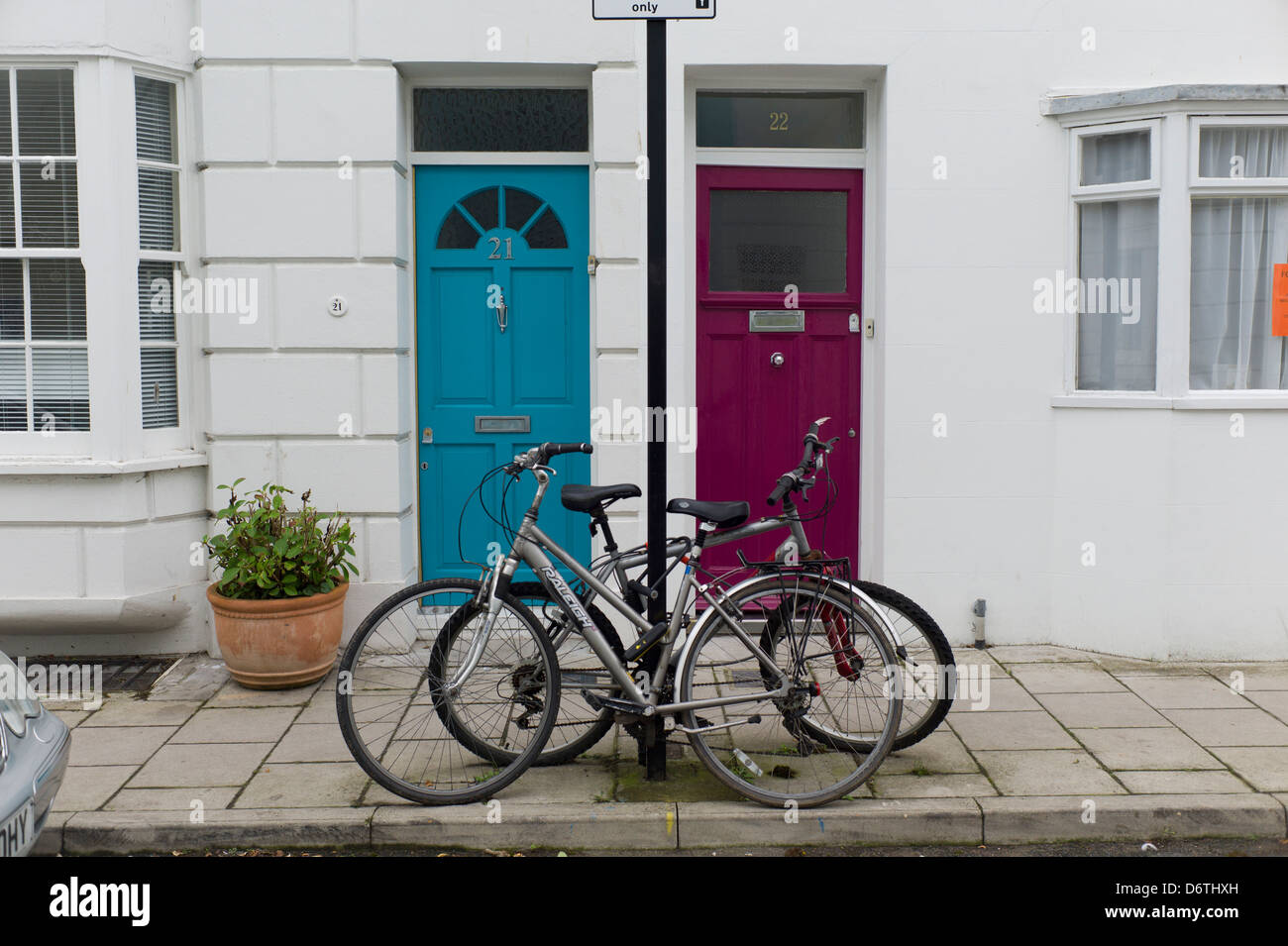 Bicycles chained to post, Brighton, UK Stock Photo