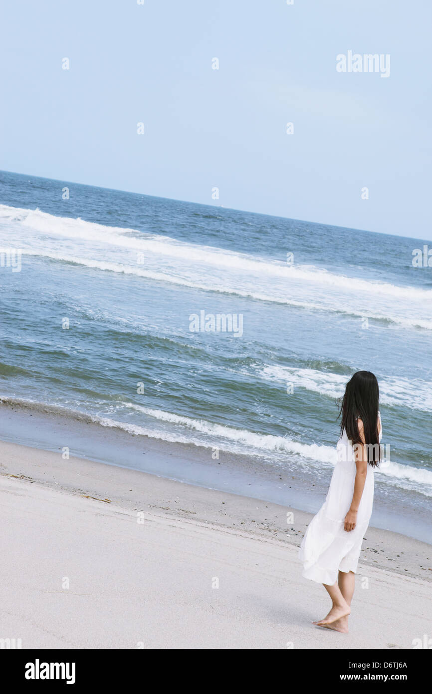 Woman in a white dress on the beach Stock Photo Alamy — free download