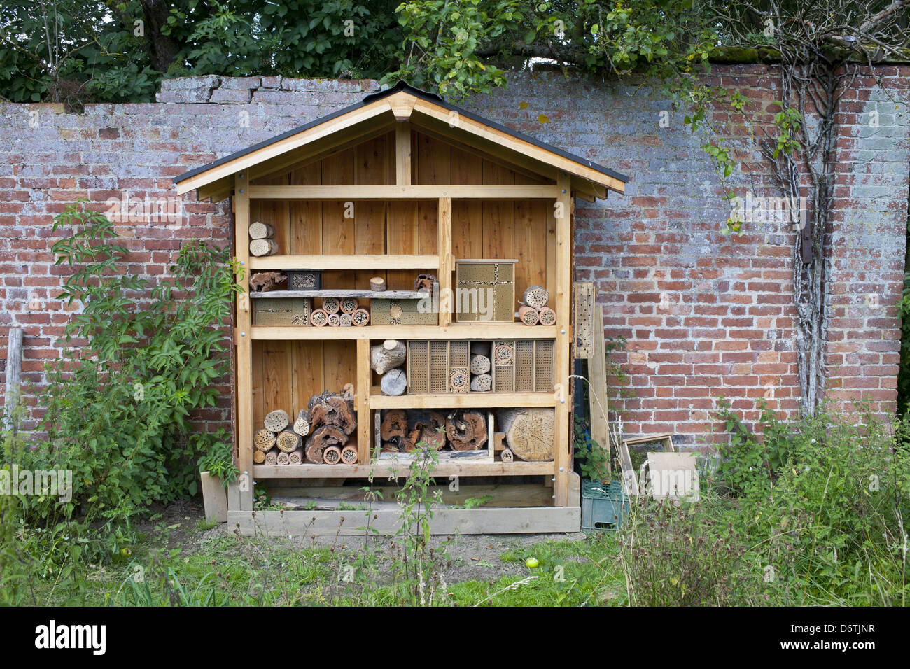 Insect ''hotel'' built to attract bees, partly filled, Preston Montford Field Centre, Shropshire, England, August Stock Photo