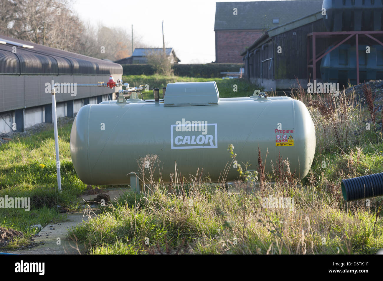 Chicken farming, Calor propane gas tank outside poultry unit, Lancashire, England, November Stock Photo