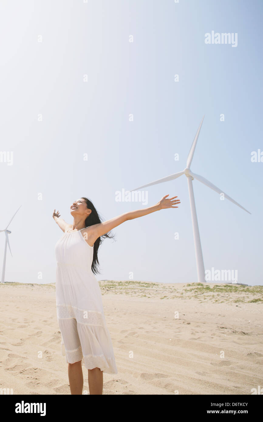 Woman in a white dress on the beach Stock Photo - Alamy