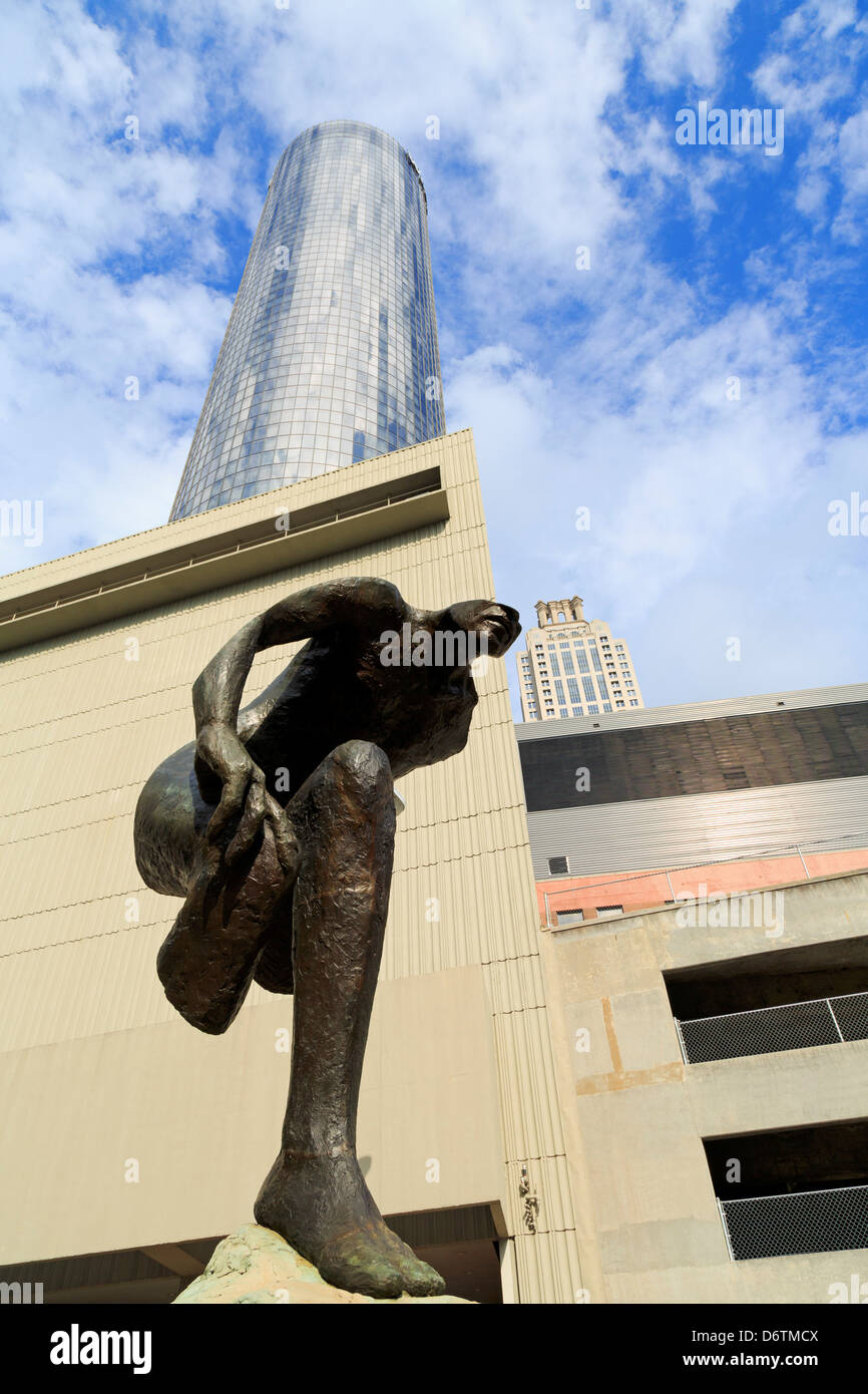 USA, Georgia, Atlanta, Emerging sculpture by Mark Smith outside Westin Hotel Stock Photo