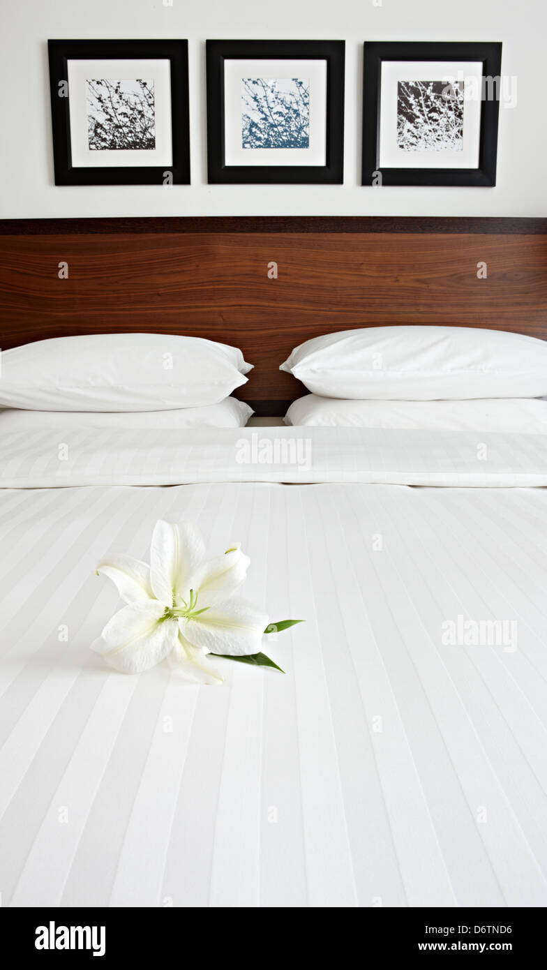 crisp made bed linen hotel Stock Photo