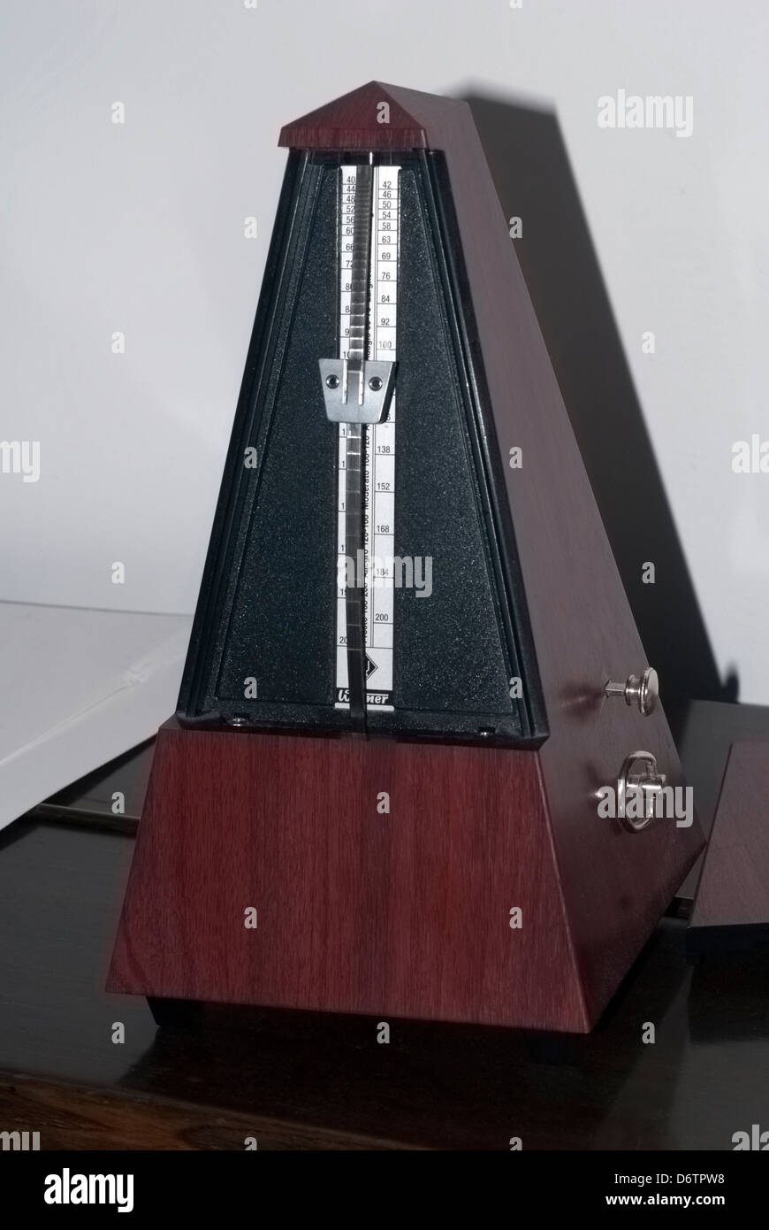 Vertical shot of a vintage metronome Stock Photo