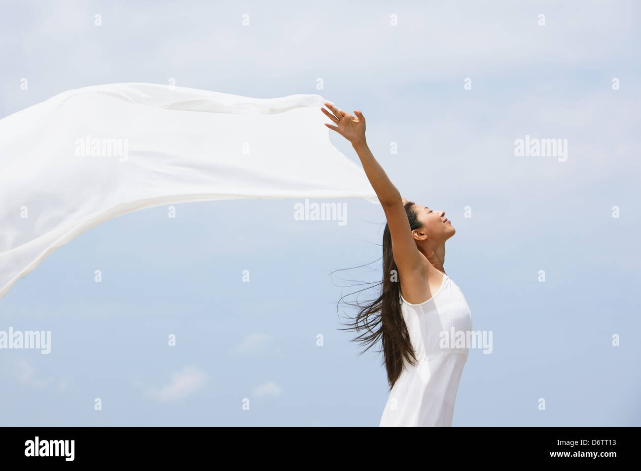 Woman in a white dress with white cloth Stock Photo
