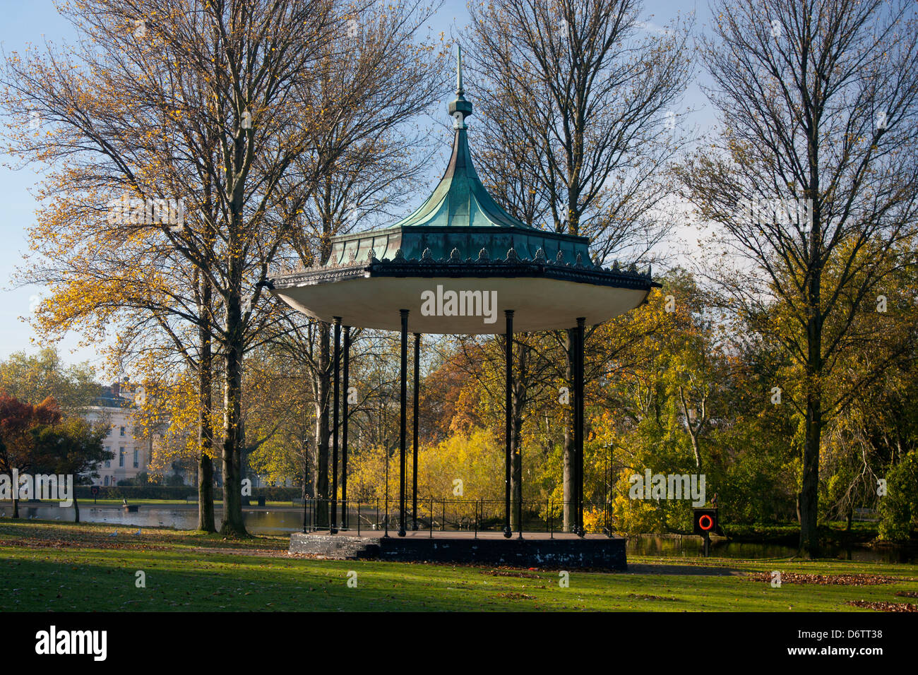 Bandstand in The Regent's Park with autumn foliage on trees behind London England UK Stock Photo