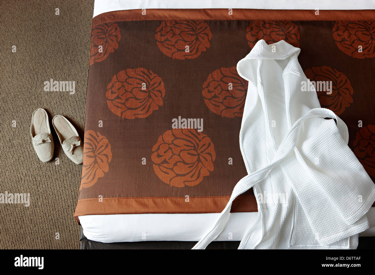 white mens dressing gown on bed Stock Photo Alamy