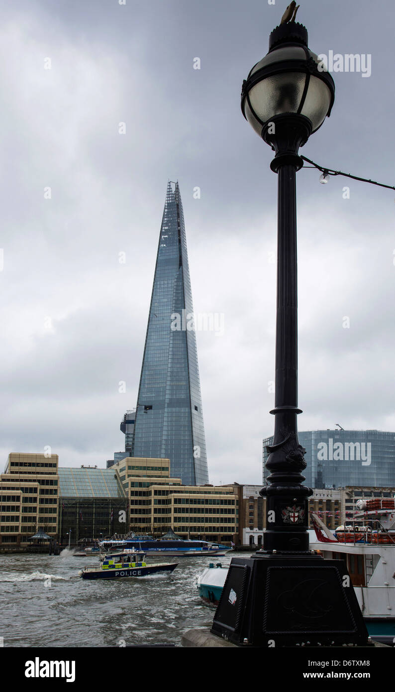 The Shard from north of the River Thames and a passing river police launch. Stock Photo