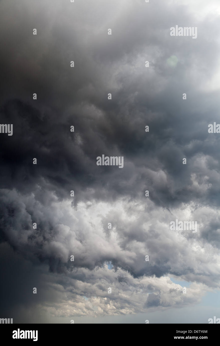 Dark storm clouds over blue sky Stock Photo - Alamy