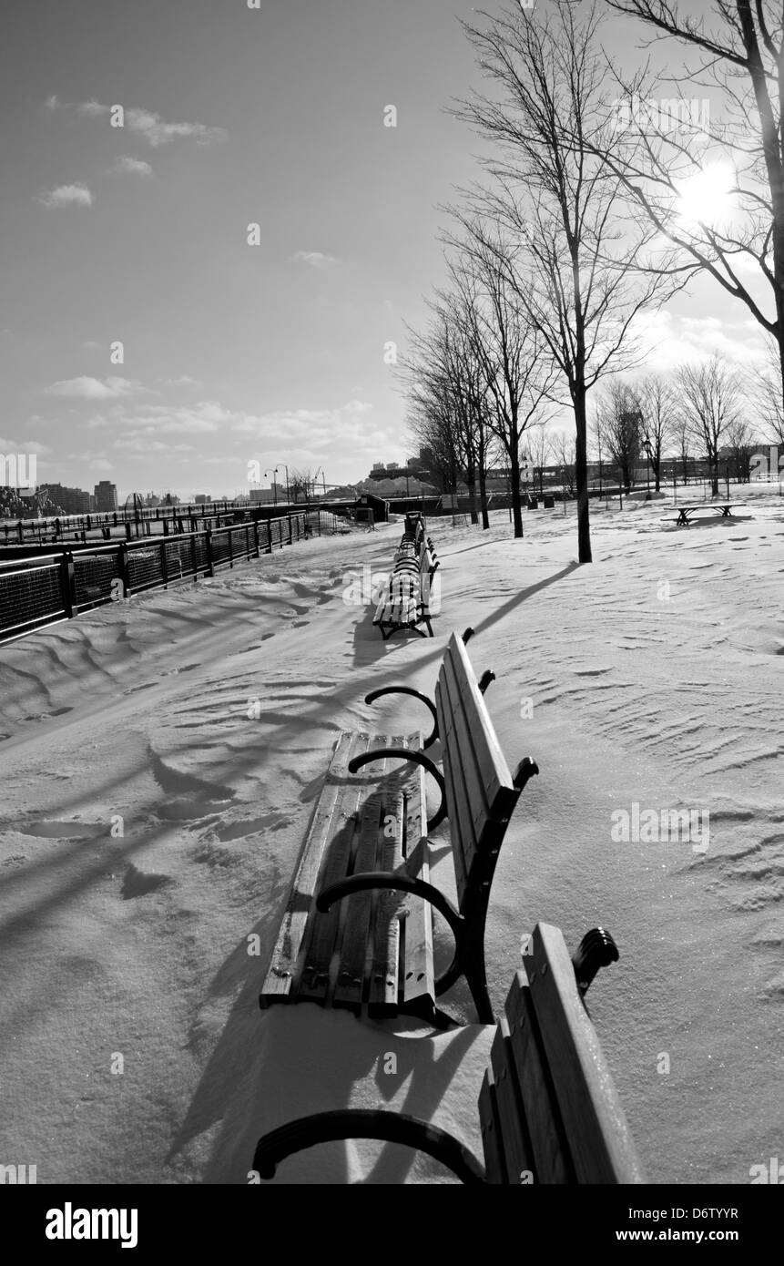 Snowed benches in Montreal's old town Stock Photo