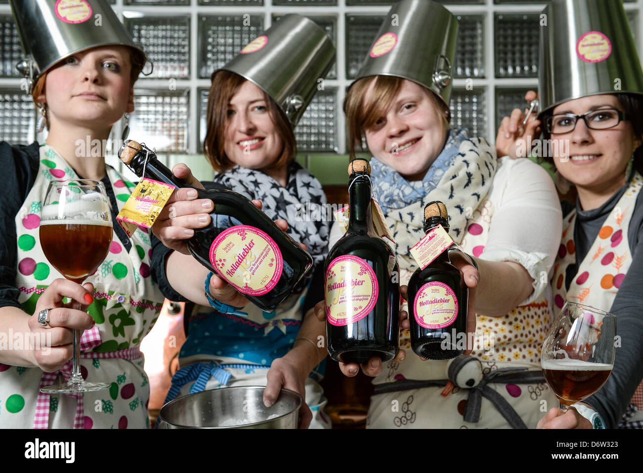 Brewer (l-r) Gisela Meinel-Hansen, Yvonne Wernlein, Monika Meinel-Hansen and Isabella Straub present on 20 April 2013 in a brewery in Trebgast ( Bavaria ) their women's beer 'Holladiebierfee' (= goshthebeerfairy). Stock Photo