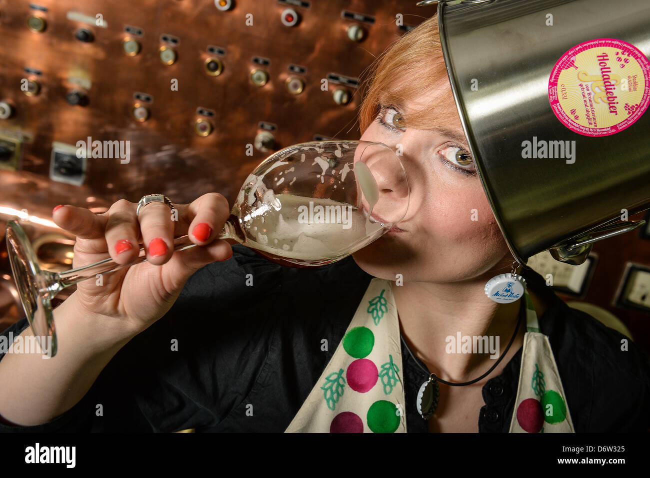 Brewer Gisela Meinel-Hansen drinks on 20 April 2013 in a brewery in Trebgast ( Bavaria ) their women's beer 'Holladiebierfee' (= goshthebeerfairy). Stock Photo