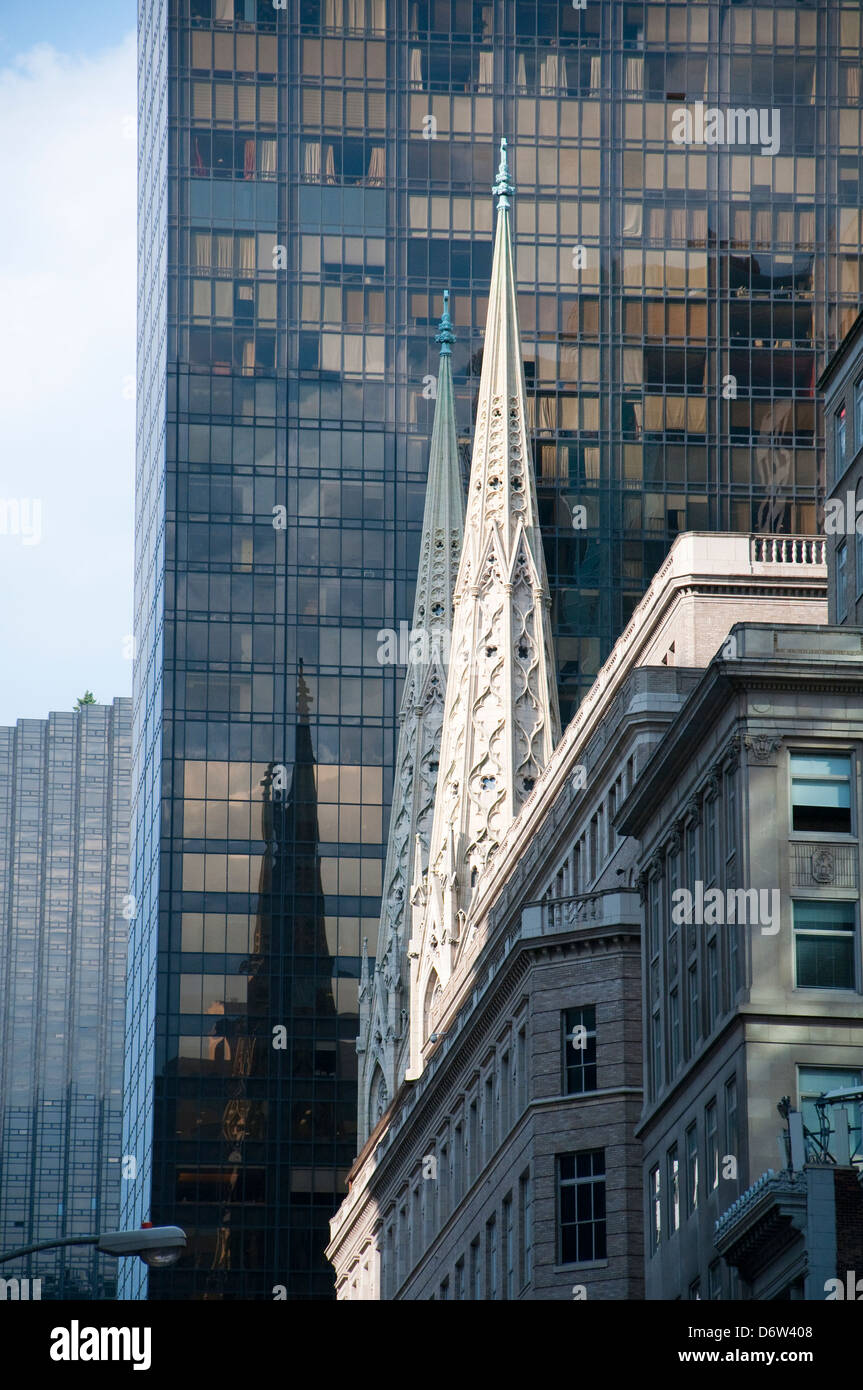 St Patrick's Cathedral next to a modern building on Fifth Avenue in New York City, USA Stock Photo