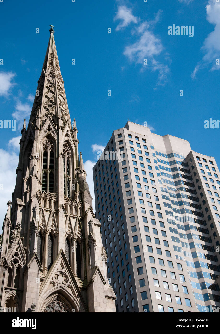 St Patrick's Cathedral next to a modern building on Fifth Avenue in New York City, USA Stock Photo