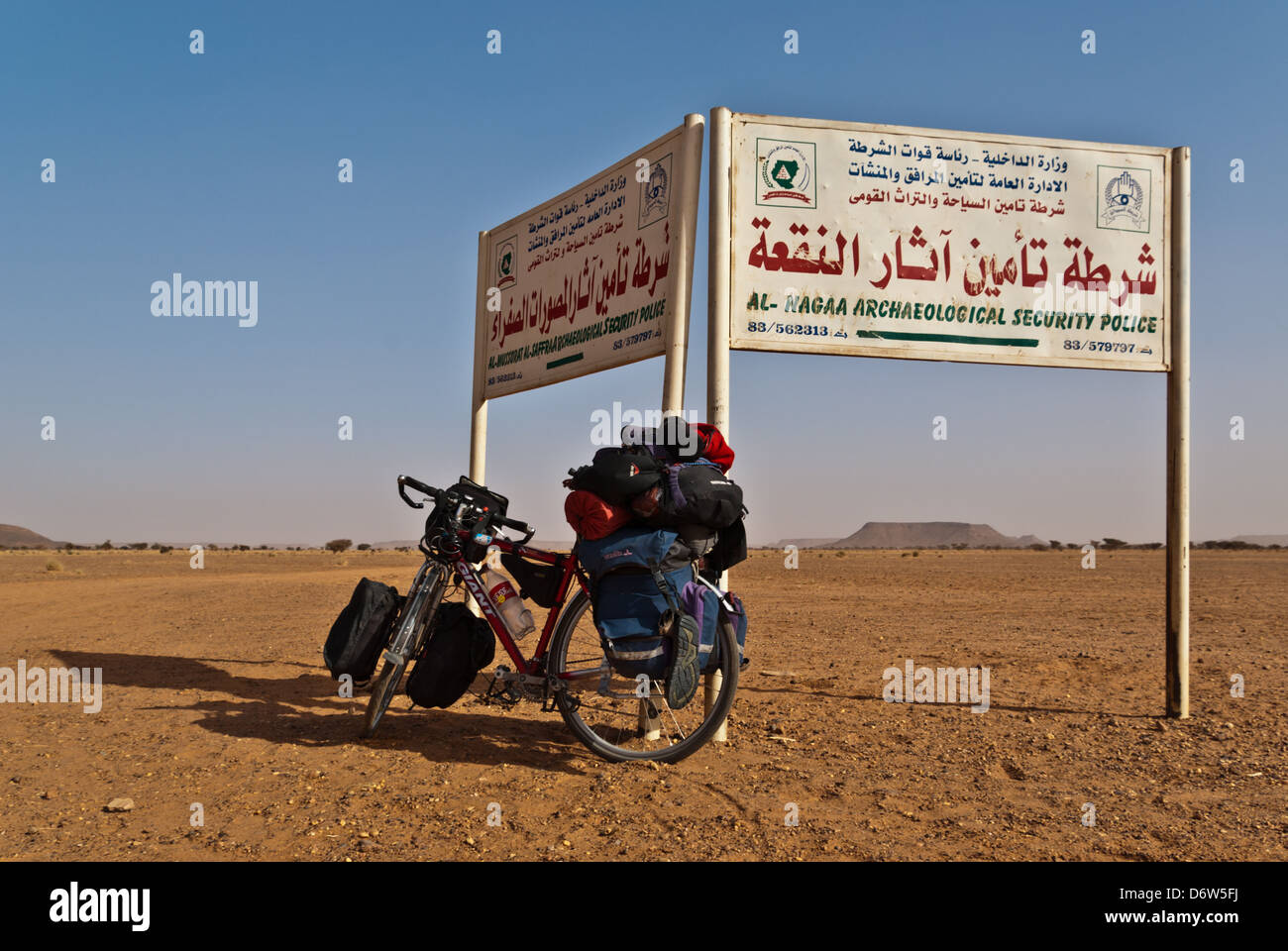 Desert Road Signs and a bicycle, Sudan Stock Photo