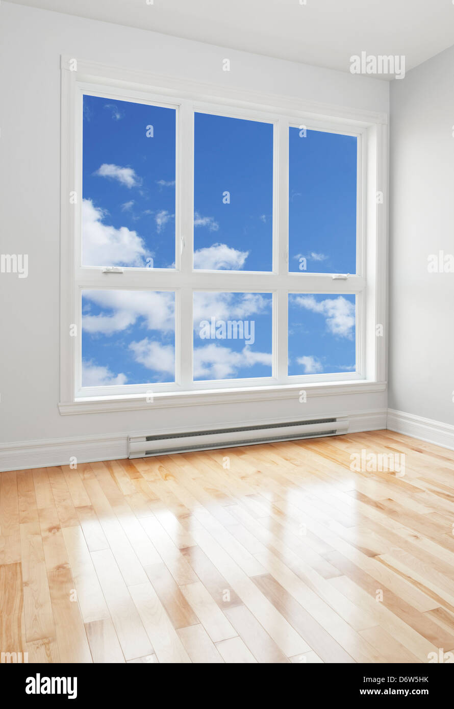 Blue sky seen through the big window of an empty room Stock Photo - Alamy