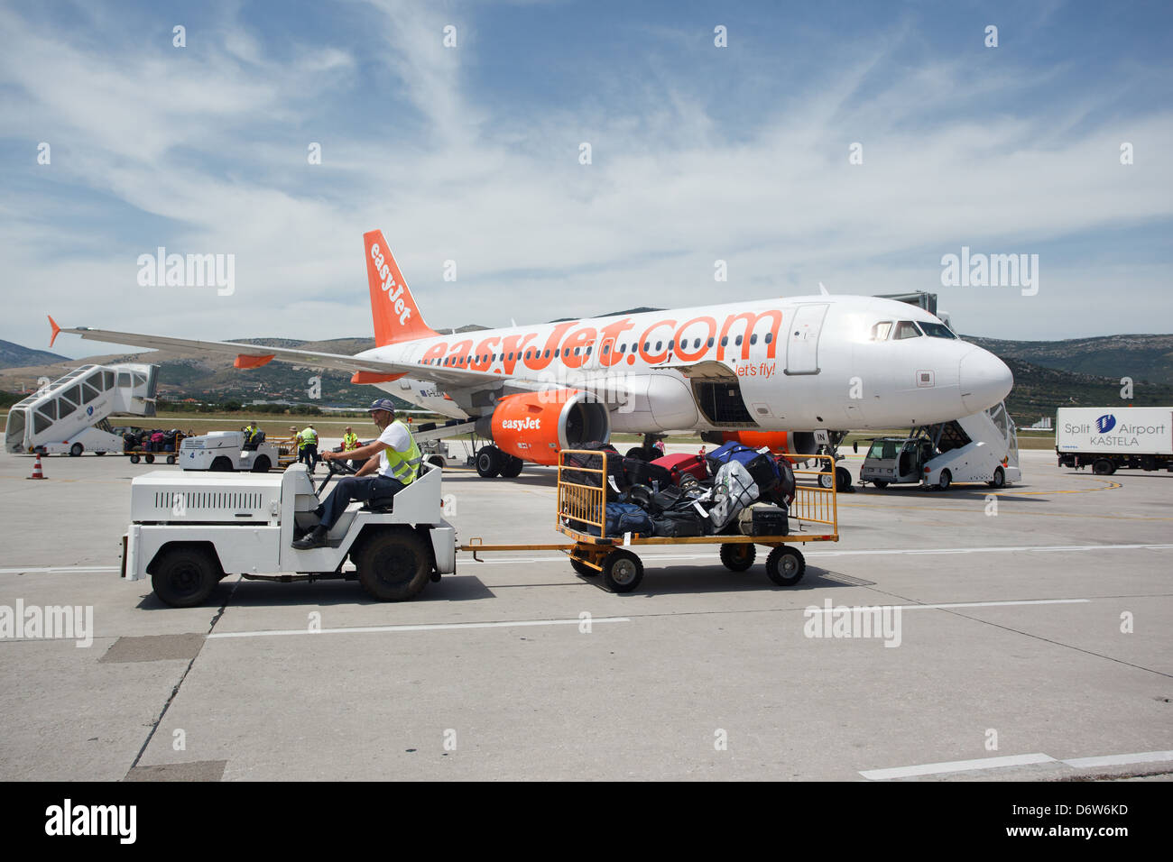 Kastela, Croatia, the aircraft easyJet Airline and luggage cart at airport Split Kastela Stock Photo
