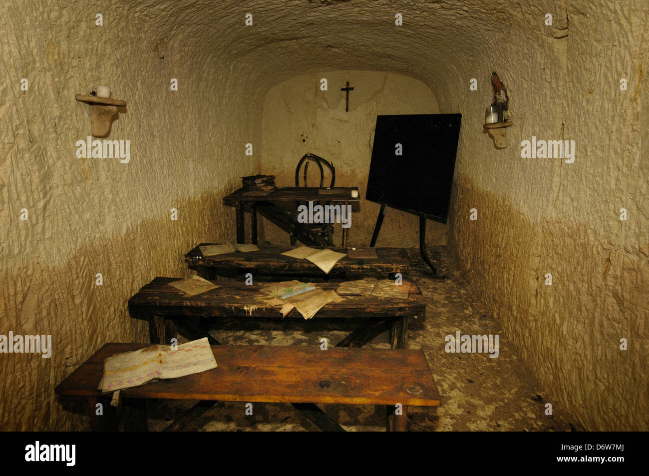 A classroom inside the 12 meter rock-hewn underground air-raid shelter used by locals during the WWII bombings of Malta in the town of Mgarr formerly known as Mgiarro, a small town in the Northern Region of Malta Stock Photo