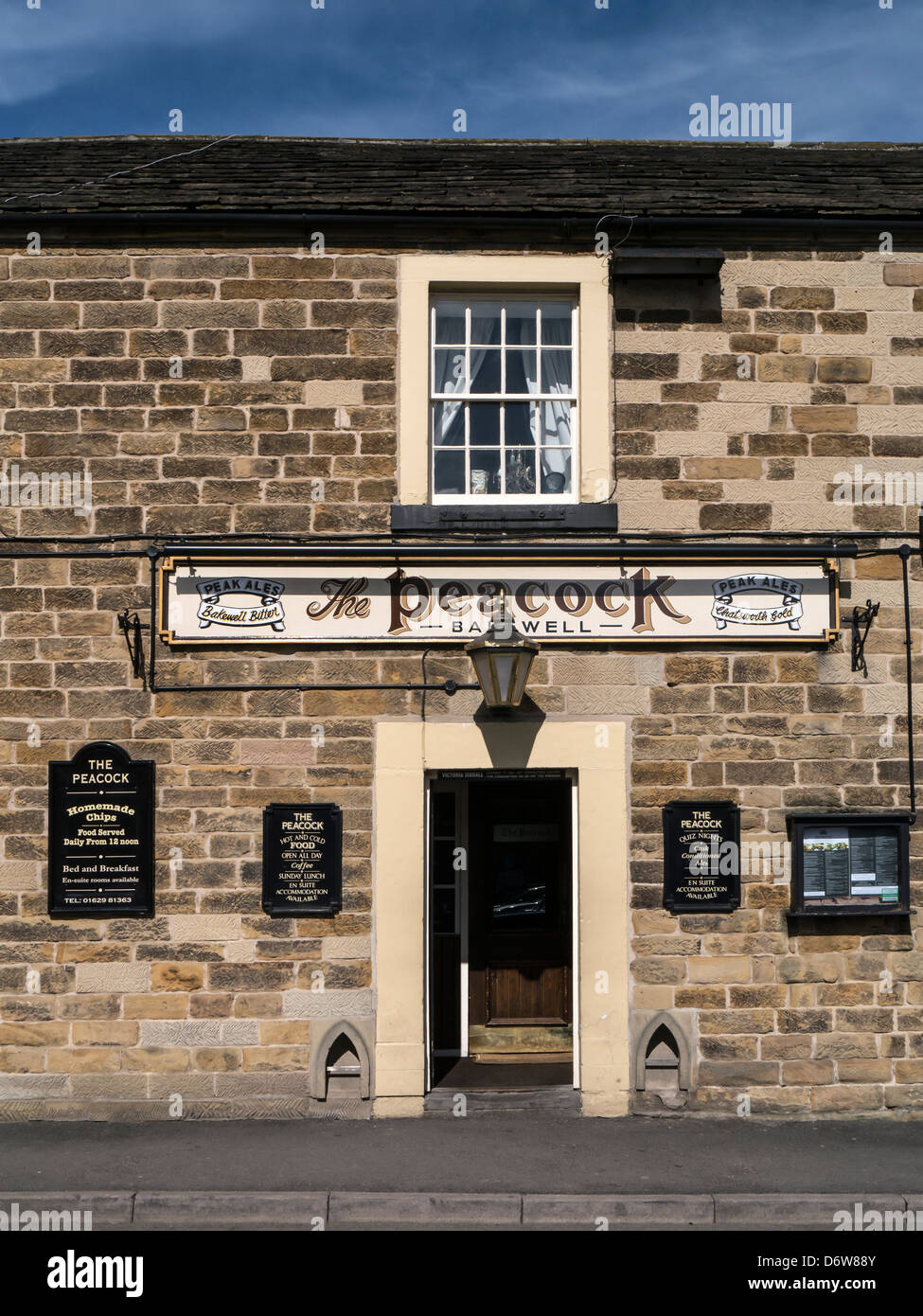 BAKEWELL, DERBYSHIRE, UK - APRIL 18, 2013:  Entrance to the Peacock Pub with sign Stock Photo