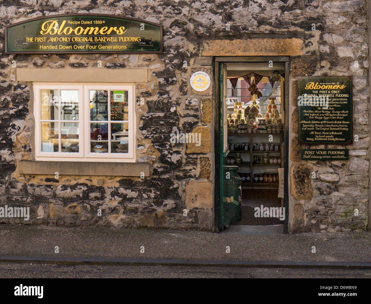 BAKEWELL, DERBYSHIRE, UK - APRIL 18, 2013:  Exterior view of pretty Bakery Delicatessen Shop Stock Photo