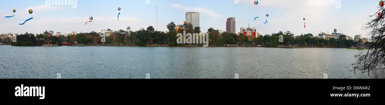 Horizontal panoramic (3 picture stitch) easterly view of Hoan Kiem Lake in Hanoi on a sunny day. Stock Photo