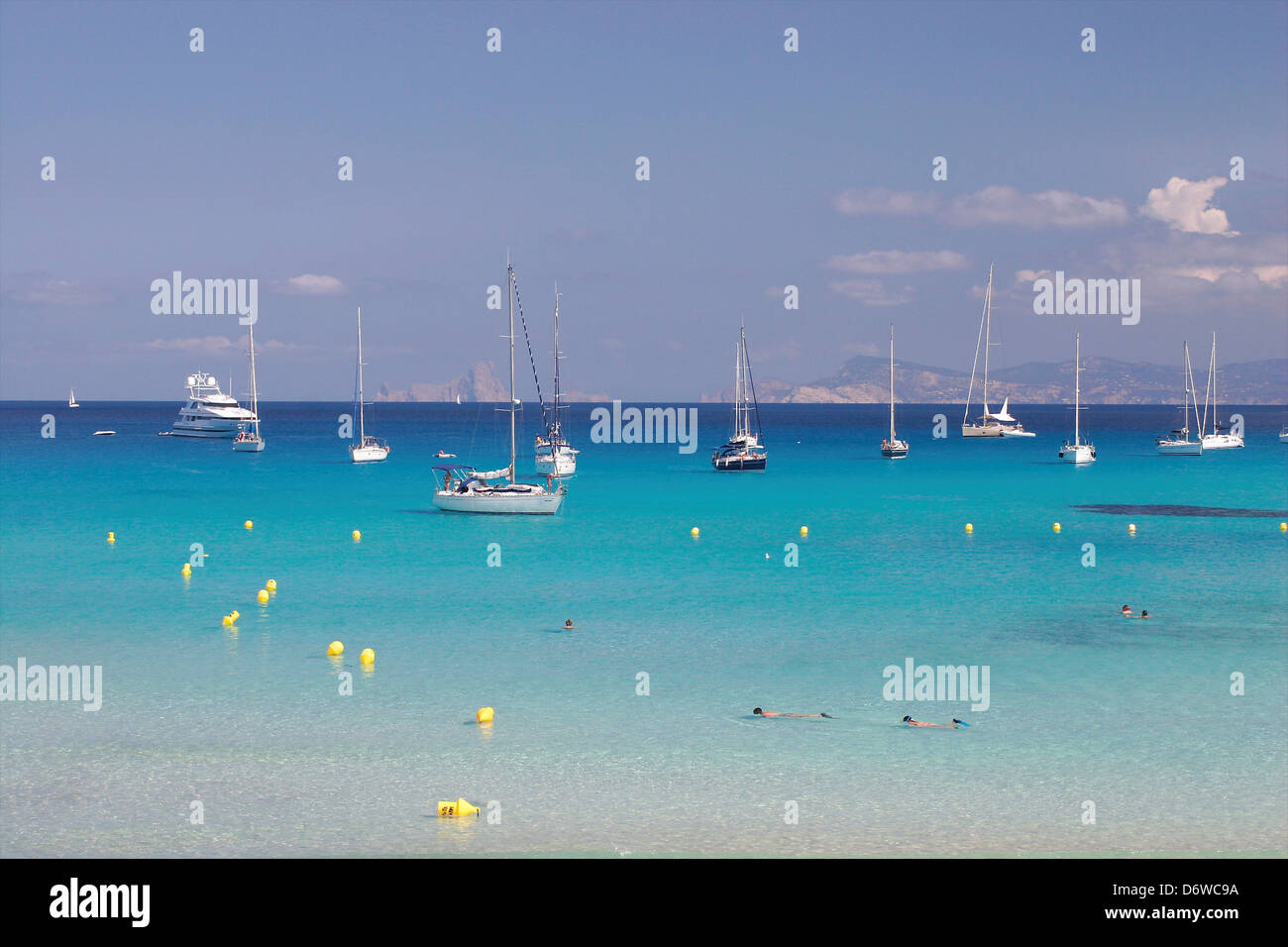 Spain, Formentera, Cala Saona, Sailing boats moored in sea bay Stock Photo Alamy