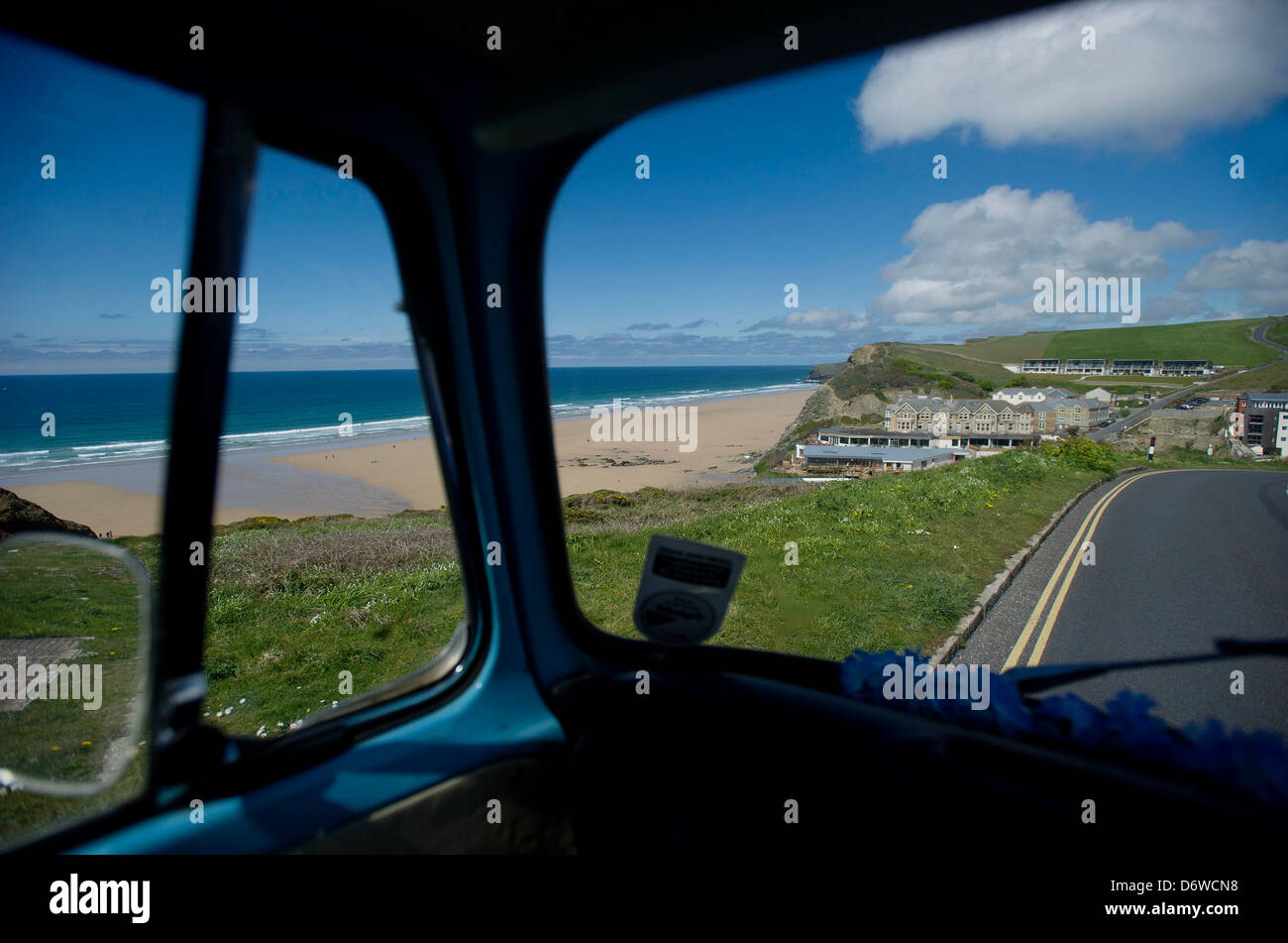 A view of Watergate Bay, Cornwall, UK, looking out through the window of a VW campervan Stock Photo