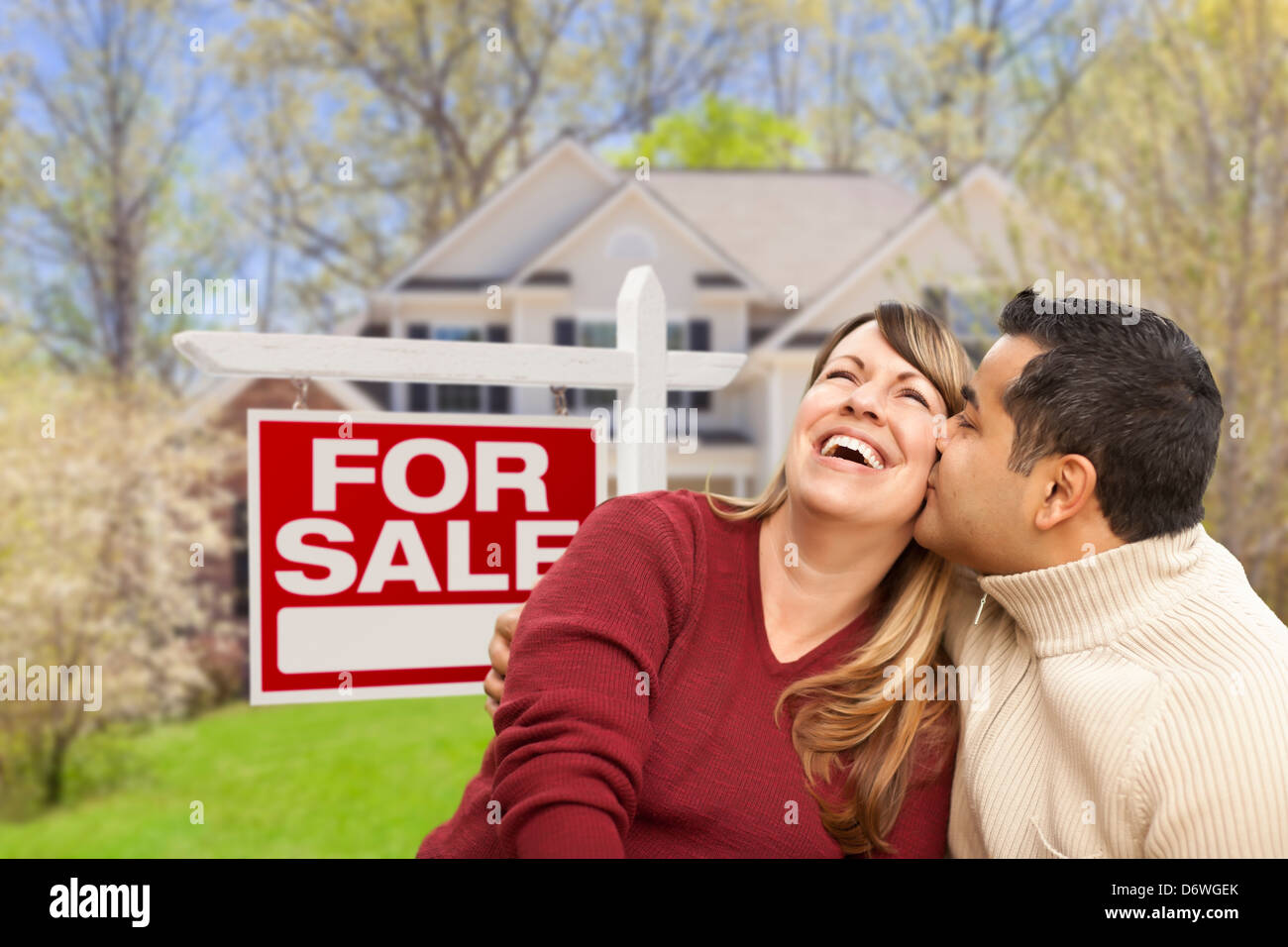 Couple outside house sold sign hi-res stock photography and images - Alamy