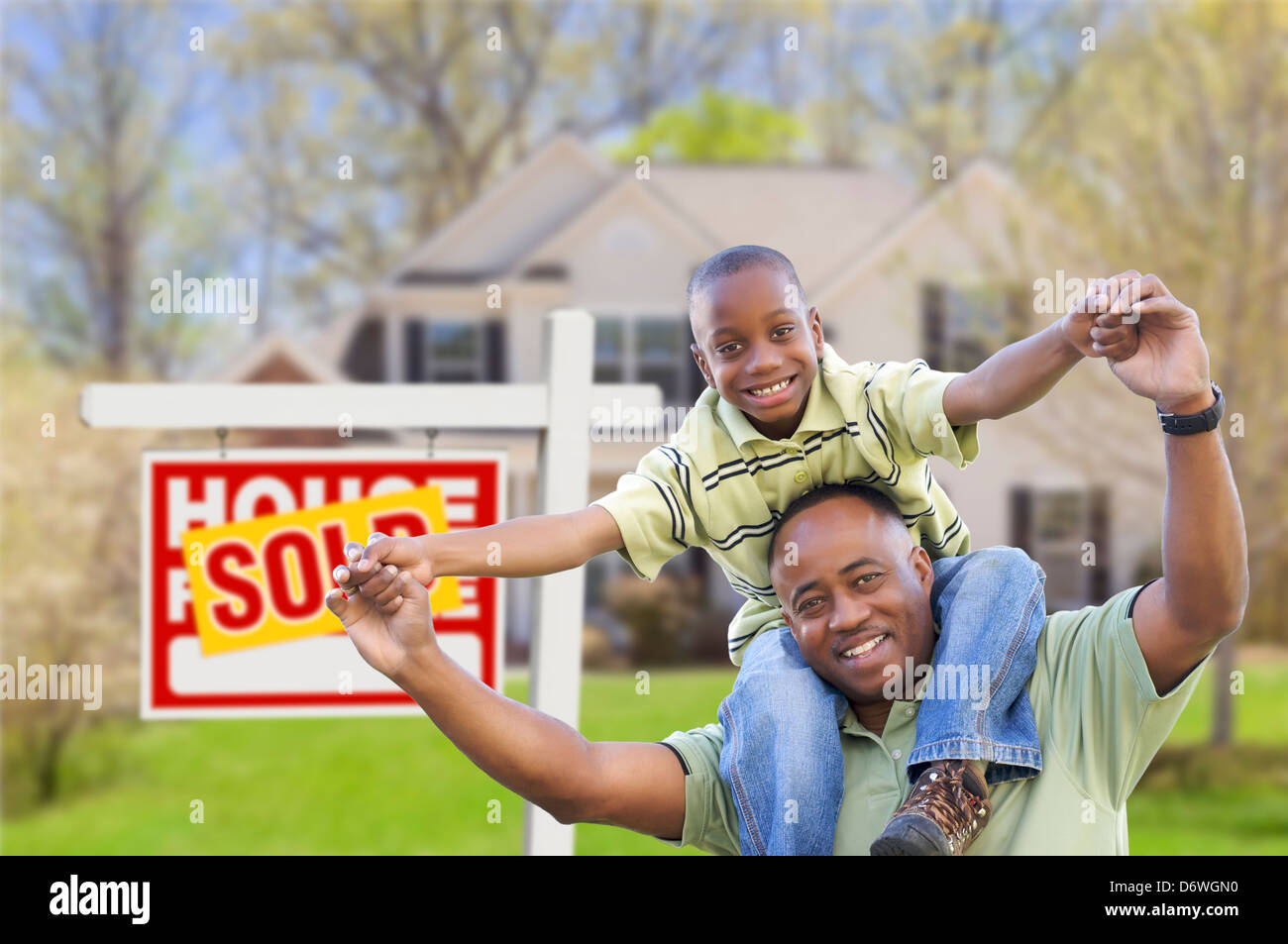 Happy African American Father and Son in Front of New Home and Sold ...