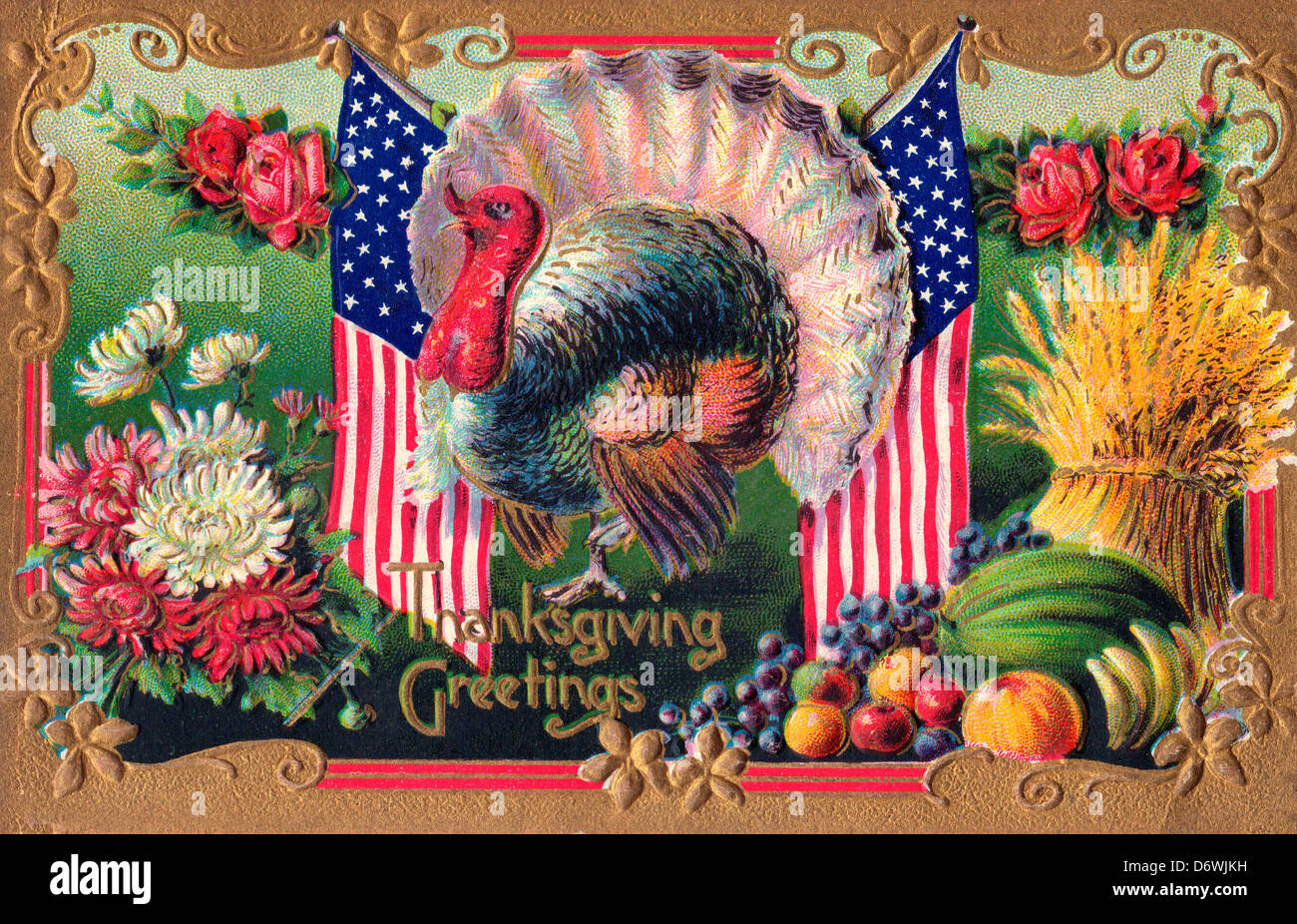 Thanksgiving Greetings - Turkey with American Flag, flowers fruits and hay Stock Photo