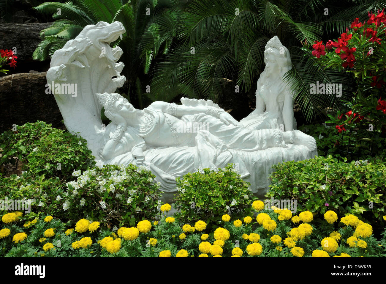 Thailand, Chonburi, Nong Nooch Garden, Flower bed with fancy sculpture  Stock Photo - Alamy