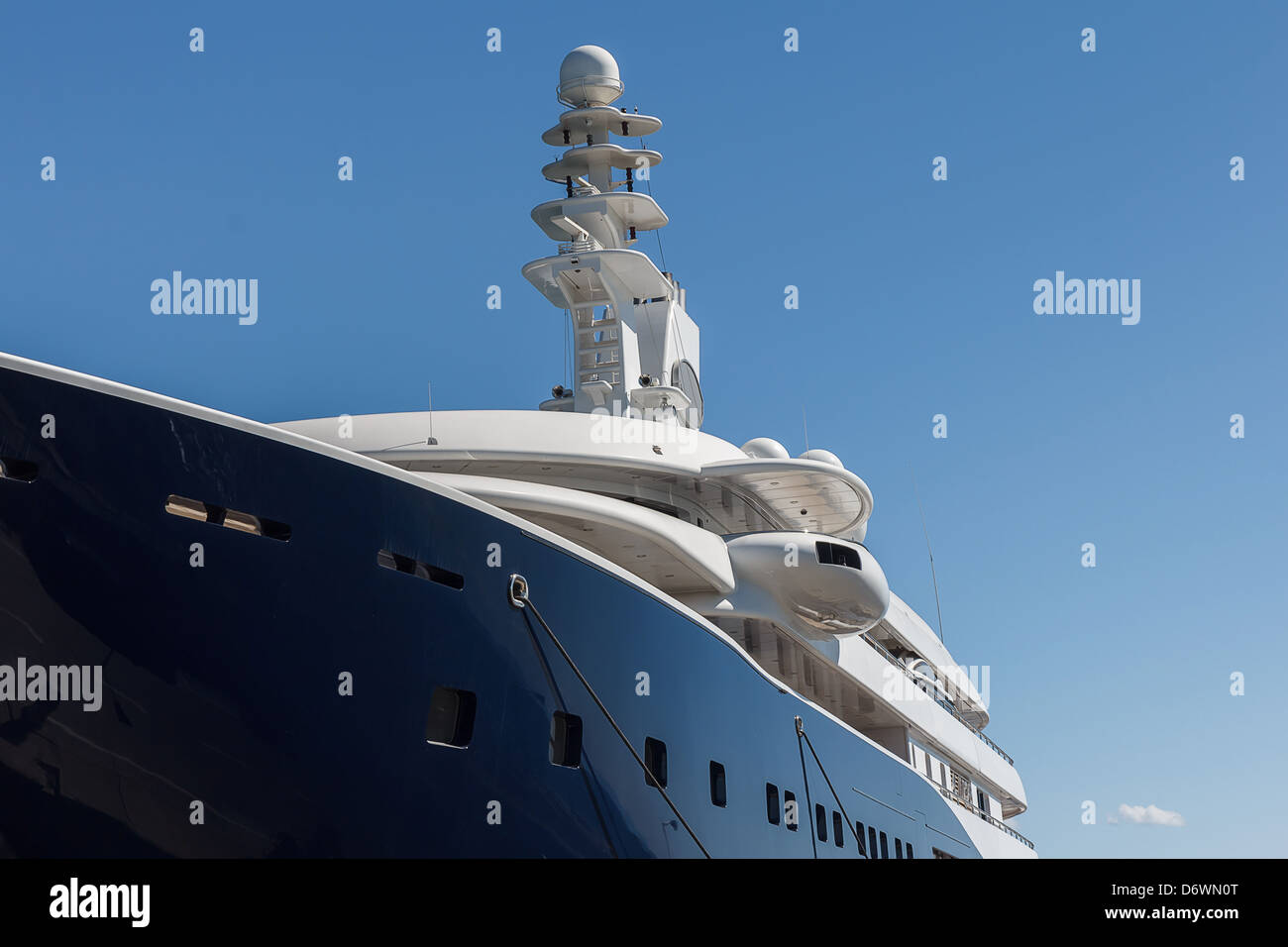 Part of large anchored ship or cruise against blue sky Stock Photo