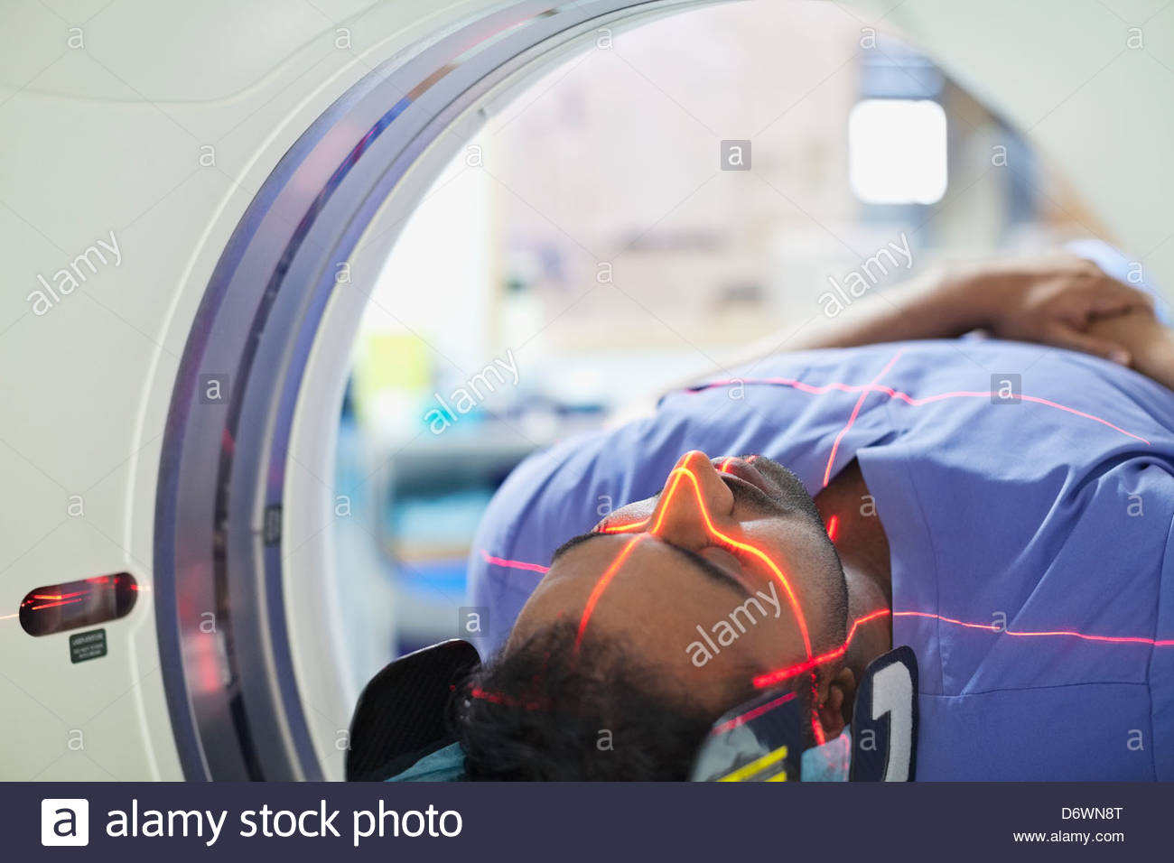 Mid adult male patient going through CAT scan Stock Photo
