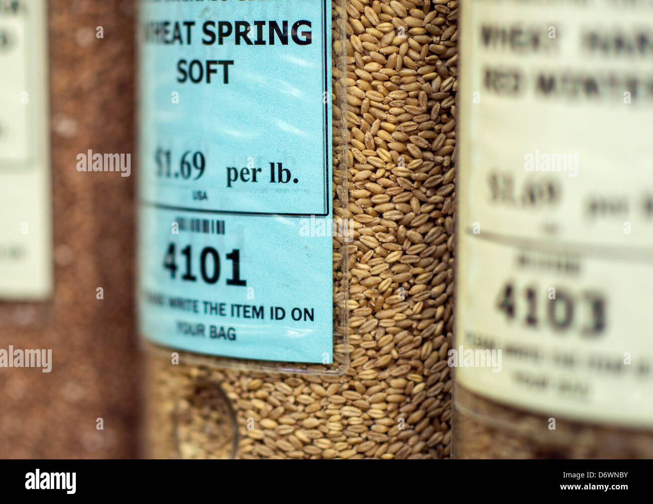 Whole organic grains in a store dispenser. Stock Photo