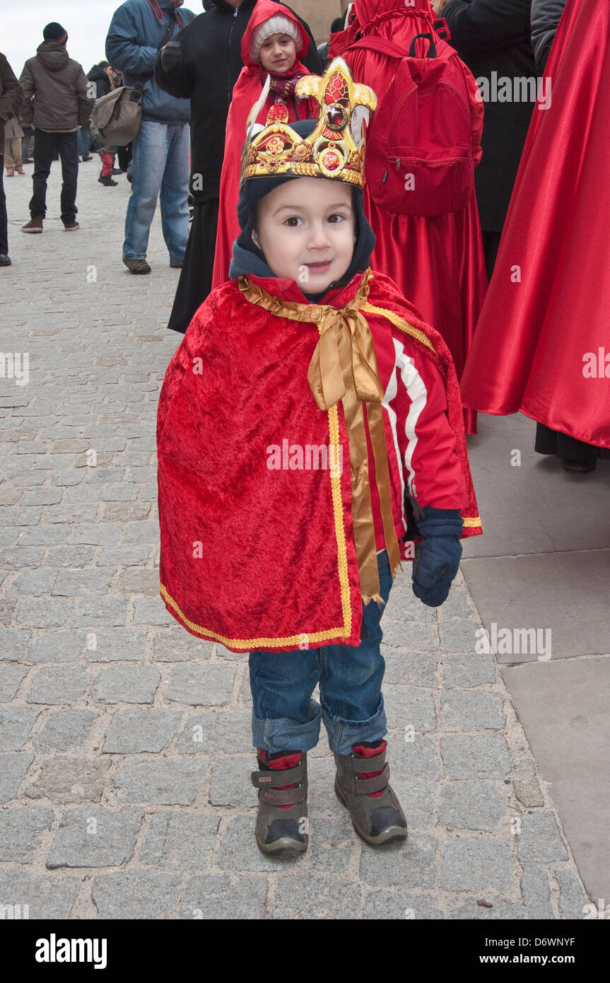 Child wearing paper crown, getting ready for Cavalcade of Magi, Epiphany Holiday procession, Krakow, Poland Stock Photo