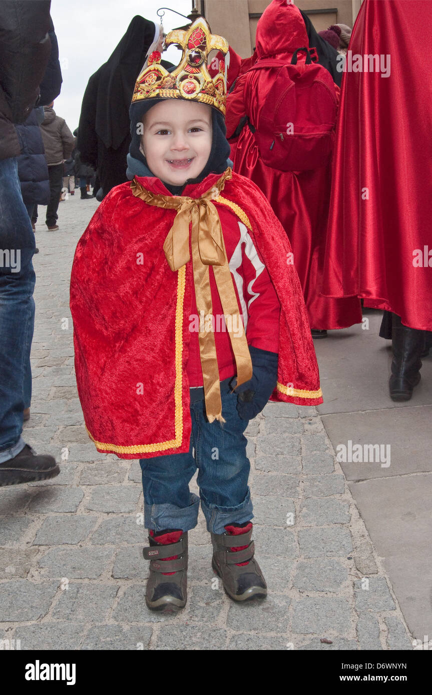 Child wearing paper crown, getting ready for Cavalcade of Magi, Epiphany Holiday procession, Krakow, Poland Stock Photo