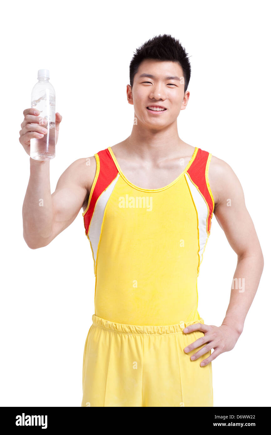 Happy young athlete holding bottled water Stock Photo Alamy