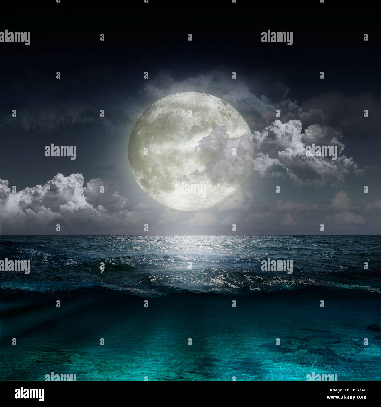 Magical evening on the ocean and the moon Stock Photo