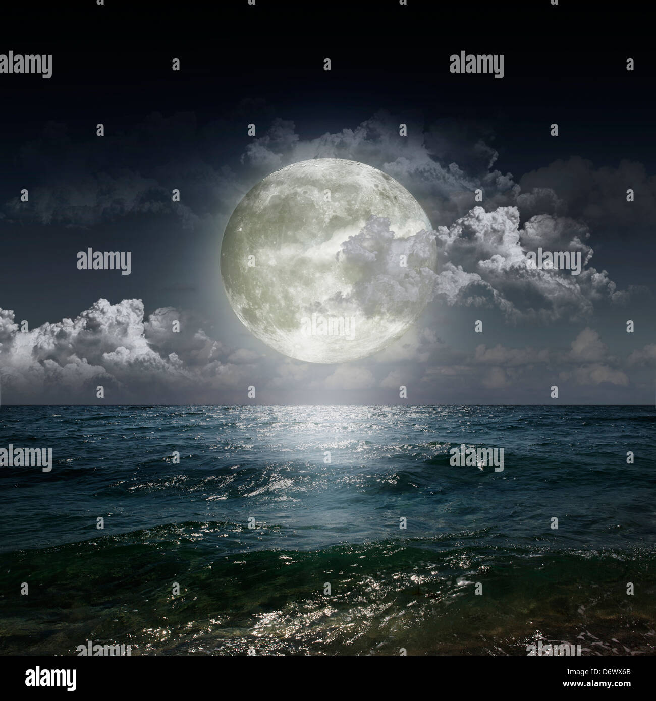 Magical evening on the ocean and the moon Stock Photo