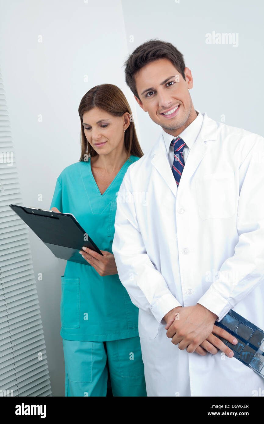 Doctor And Dental Nurse With Reports Stock Photo