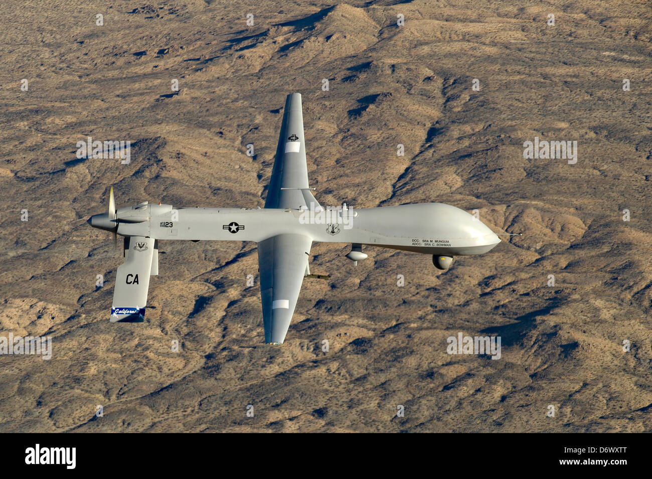 US Air Force MQ-1 Predator unmanned aerial vehicle assigned to the California Air National Guard's 163rd Reconnaissance Wing in flight over Southern California January 7, 2012 in Victorville, CA. Stock Photo