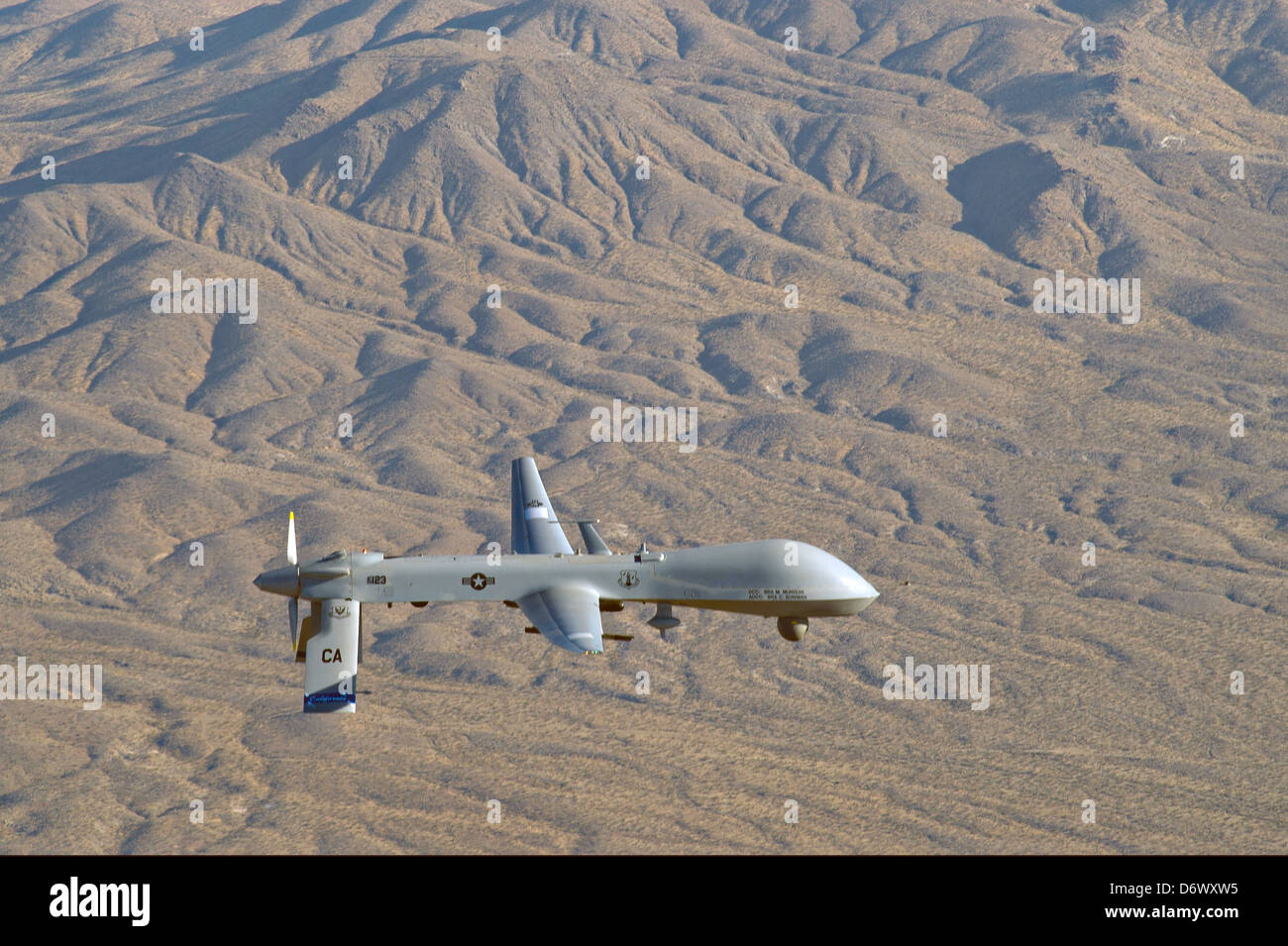 US Air Force MQ-1 Predator unmanned aerial vehicle assigned to the California Air National Guard's 163rd Reconnaissance Wing in flight over Southern California January 7, 2012 in Victorville, CA. Stock Photo